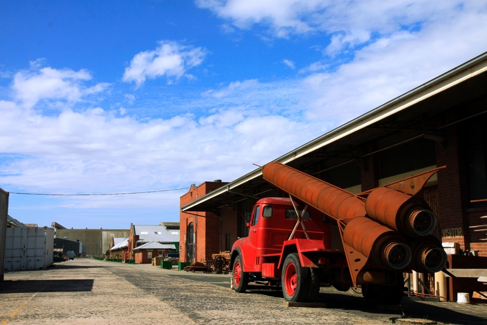 Just your run of the mill pick up truck with a rocket on the back in your usual block of warehouses.