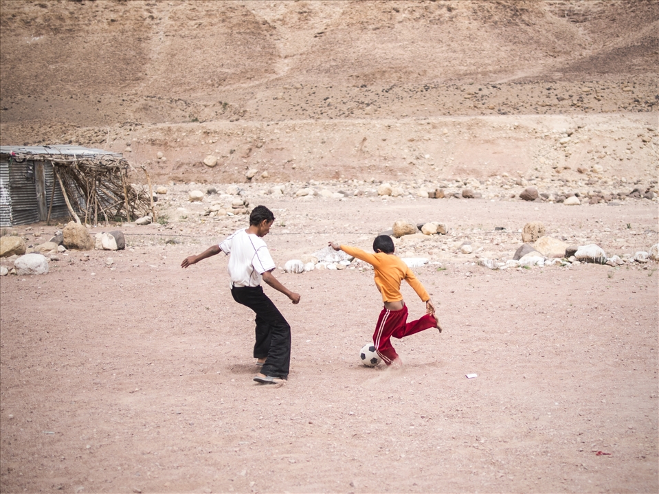 The current generation of kids will experience a transition from nomadic to urban living but for the time being the freedom of a simple lifestyle offers a great deal of opportunity for spontaneous soccer matches. The sharp gravel consists of granite, quartz and various other sole destroying minerals but these boys play with all the fervour of a world cup match at the smallest opportunity. 