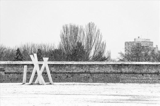 The ugly weather keeps the people outside the walls that surround the citadel. 
There is no place to protect yourself from rain and snow but if you cross the big wooden doors you'll find yourself far away from the hustle and bustle of the city in a few steps.