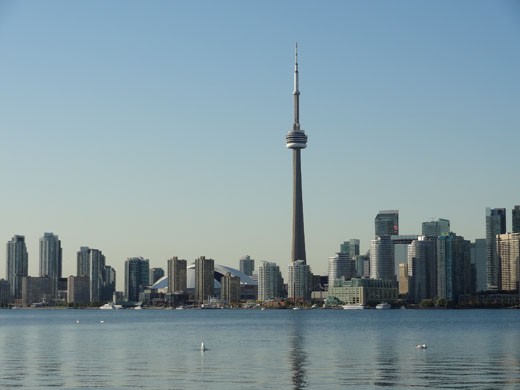 The city of Toronto is the capital of Canada and one of the most diverse cities in North America. The city's skyline is easily recognizable and prominently features the CN Tower, seen here during a beautiful Summer's day.  