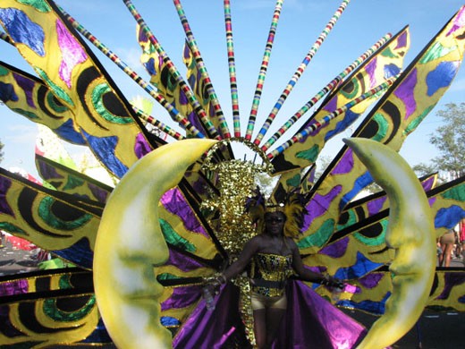 An extravagant Caribbean Goddess during the Scotiabank Toronto Caribbean Carnival, a special event that is still most widely recognized as Caribana, despite the recent name change. The street festival and huge parade celebrates culture and tradition with numerous floats, music and dancing.