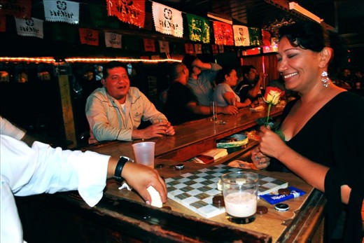 locals interacting in a small bar. Tijuana Mexico