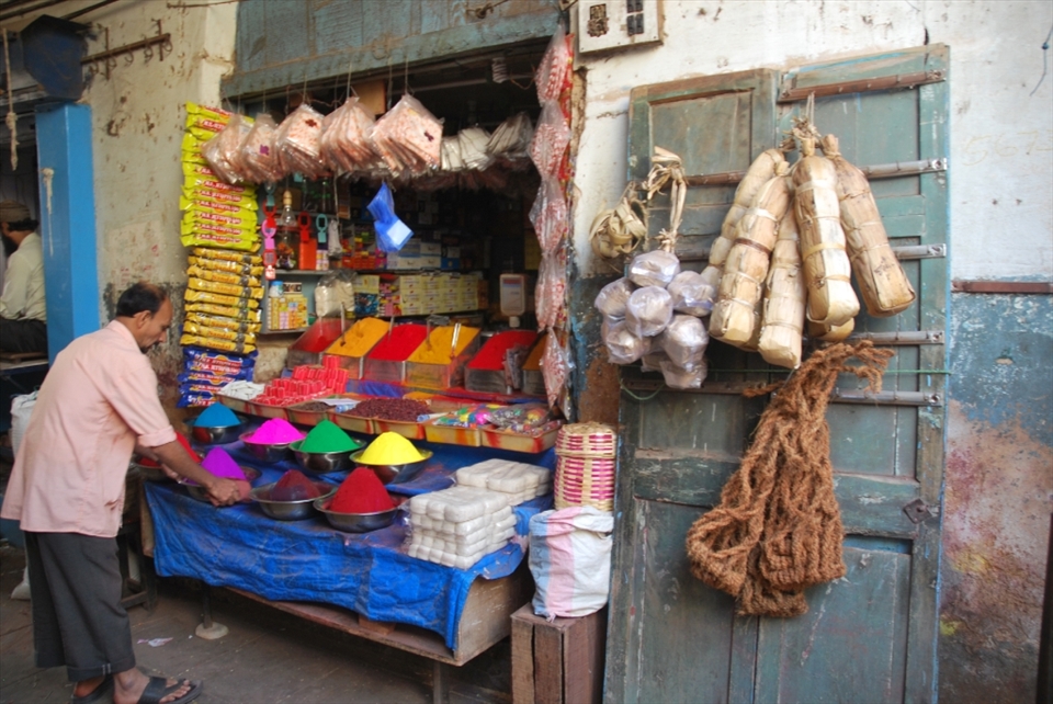 “Family business”.  This shopkeeper tidies bowls filled with colorful kum kum powder in his family business. Many of the small shops like this are passed down from one generation to the next and many of the shopkeepers seem to enjoy talking and interacting with others in the busy market. One young shopkeeper proudly showed us his personal “facebook” – a tired notebook with pictures and short messages written by travelers from all over the world who stopped by his stand over the years. A nice reminder that curiosity about other cultures and the world around us is a universal feeling.