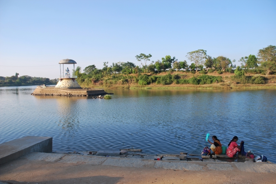 “Balancing with Nature”.  The role of nature and people’s responsibility towards it is still unclear it seems in many parts of southern India. This river runs along the edge of Saraguru and while it is revered (a temple can be seen in the middle of the river) and valued for its role in agricultural irrigation and domestic uses, certain practices such as washing clothes along the bank introduces soaps and toxins into the water. This is affecting some of the fish populations and degrading the health of the ecosystem. Without the proper infrastructure to change those practices though, it is a hard battle to fight.