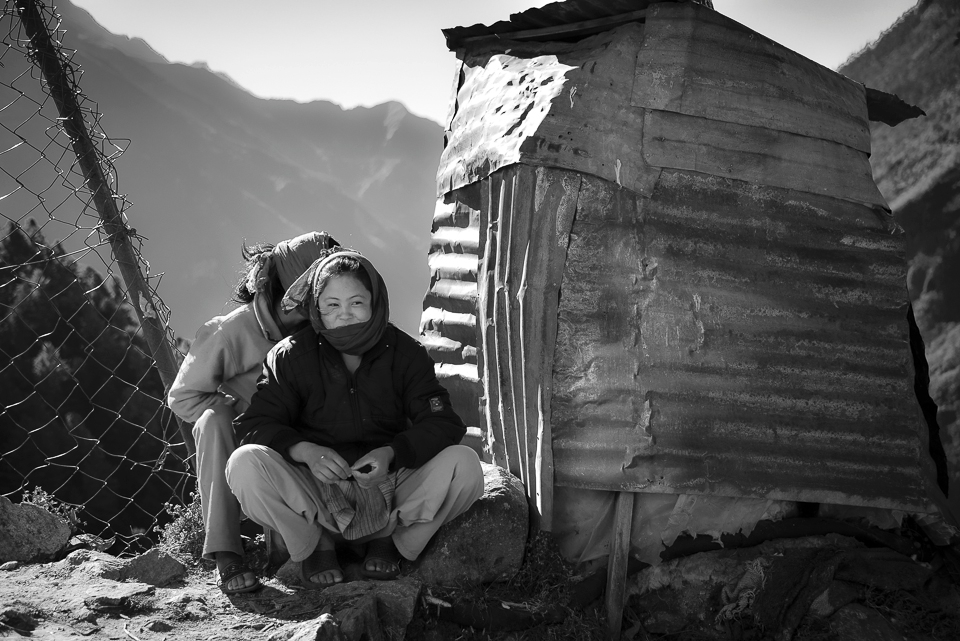 Once a week there's a small market in Namche Bazaar, the largest town along the trail to Everest. The Khumbu people gather from all around and trade everything from yaks to mobile phones. I found these two hiding behind their mother's vegetable stall, taking a break from the bartering. 