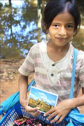 Despite of an untidy dress, this young Khmerian postcard-girl gained a lot of sales merely with her soft voice, beautiful dark brown eyes, and precious smile.: by jeffpeteza, Views[640]