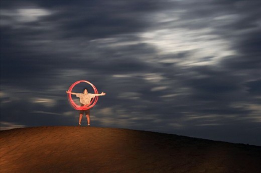 Light painting under moonlit clouds in Death Valley