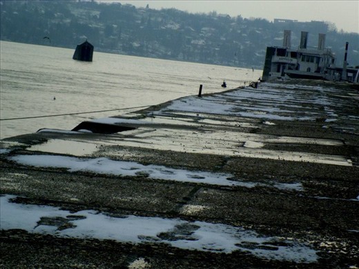 Sun comes out. Snow is slowly melting and ships are finally coming to rest on the dock.