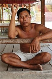 Khmer local man on Koh Rong Island relaxing out of the hot days sun: by jemalee, Views[614]