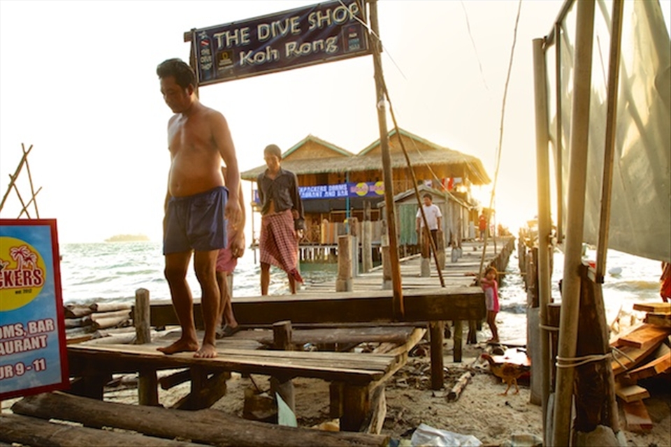 Koh Rong Island, Cambodia. Fisherman and women return from dawn fishing