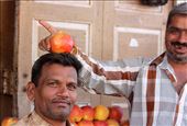 A moment of humour between two sellers of pomegranates in Palitana: by jendow, Views[258]