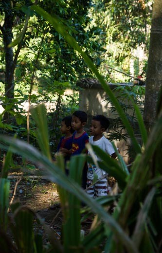 Fortunate enough to be welcomed into a small village near Sengiggi, on the island of Lombok, Indonesia, I was able to witness the community coming together for the important festival of Eid Al Adha. Some wore traditional head scarves whilst others wore board shorts.  Here younger children keep their distance from the sacrificing action, whilst others got involved, rituals being passed from generation to generation. 