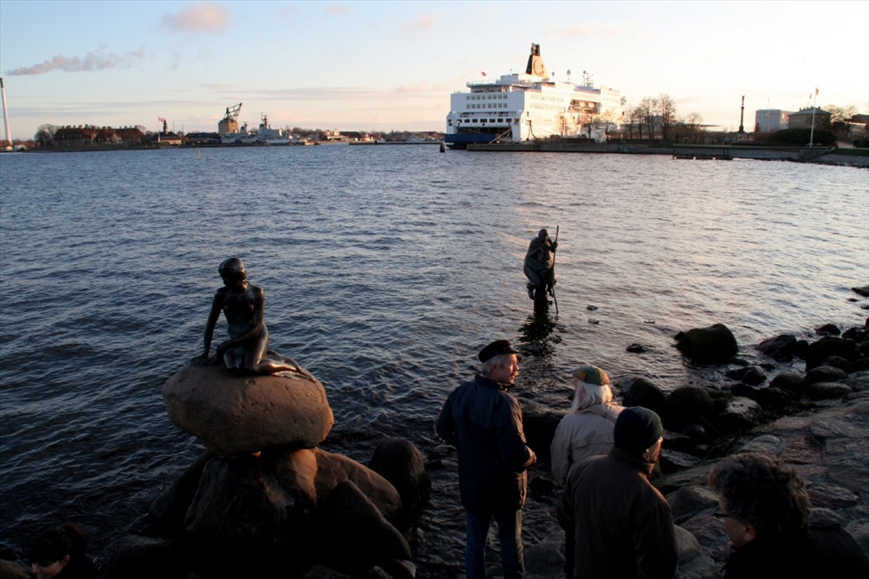 An artist had placed this gruesome statue next to The Little Mermaid. The statue represents the fat first world countries being carried on the shoulders of the skinny third world countries. A very powerful contrast.