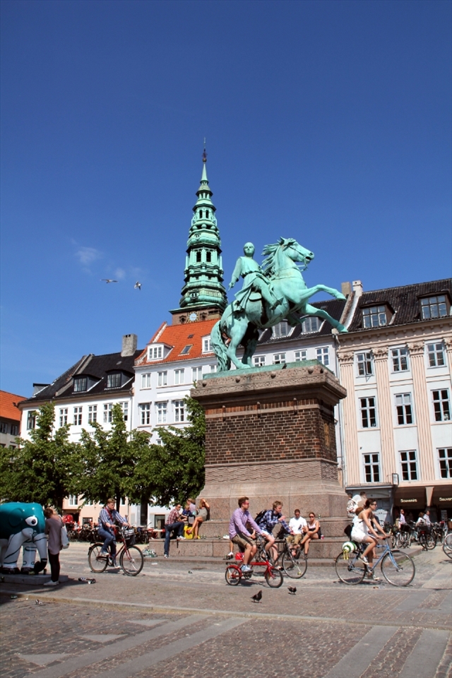Horseback riding meets cycling when classic and modern clash in Copenhagen during summertime.