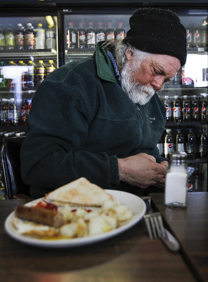 Prior to heading out on the ice, Frank Kenyon reflects over breakfast.