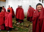 Nuns gather joyfully outside of the du-khong, or main meditation hall, before mid-day prayer. Without access to the same funding as their male counterparts, the nuns were forced to build the meditation hall entirely by themselves over a period of three years. They recall it as one would a dream, still unsure of how they managed the incredible feat of carrying the wooden planks up the mountain, mixing the materials together, and constructing the building.: by jessbenjamin, Views[305]