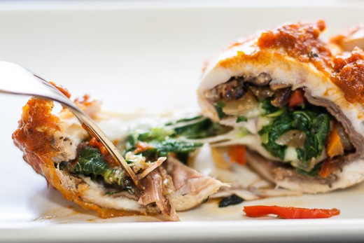 The cheese and the prosciutto are the stars of this stuffed chicken dish!