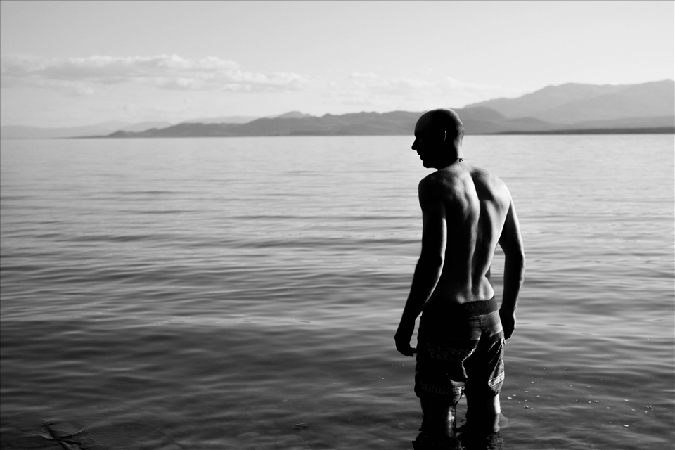 Having a swim in the turquoise waters Lake Laberge.