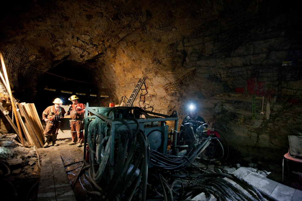 A drilling crew at work in a mine shaft at Cantung