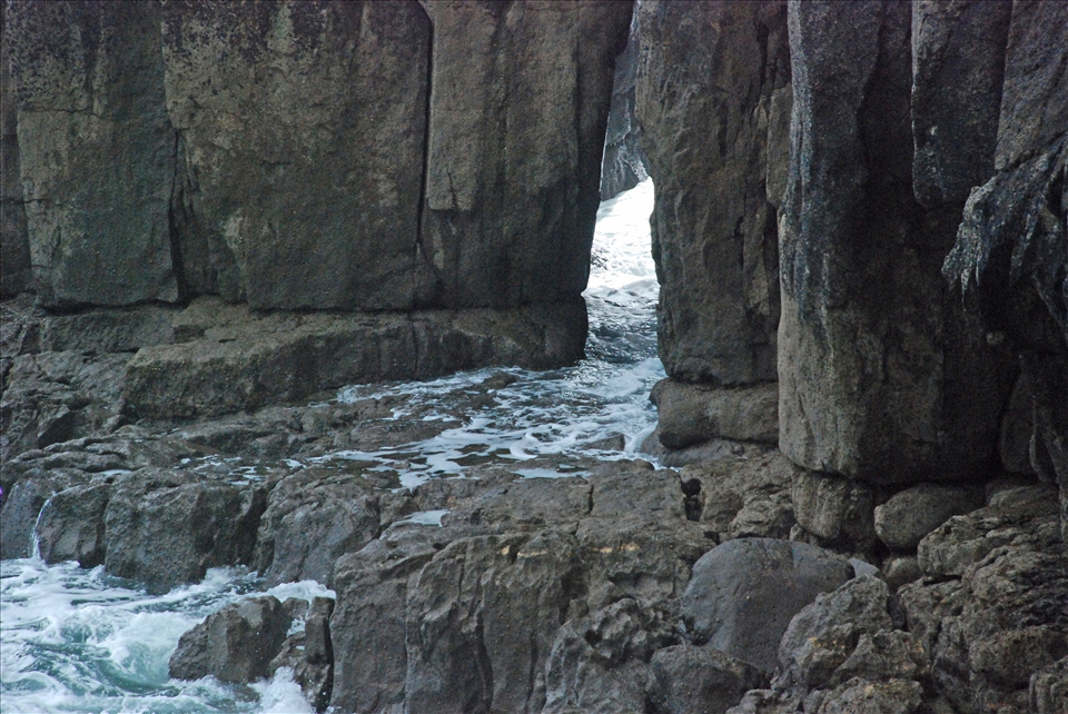 Tide water coming in at this time, slipping through over these rocks, 