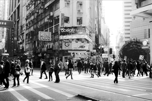 the faceless, nameless people hustling and bustling on the streets of Hong Kong