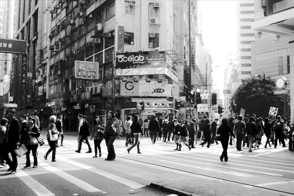 the faceless, nameless people hustling and bustling on the streets of Hong Kong