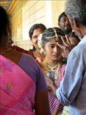 Lost in a sea of smiles on her wedding day, a young bride stares vacantly.: by jessnewell, Views[258]