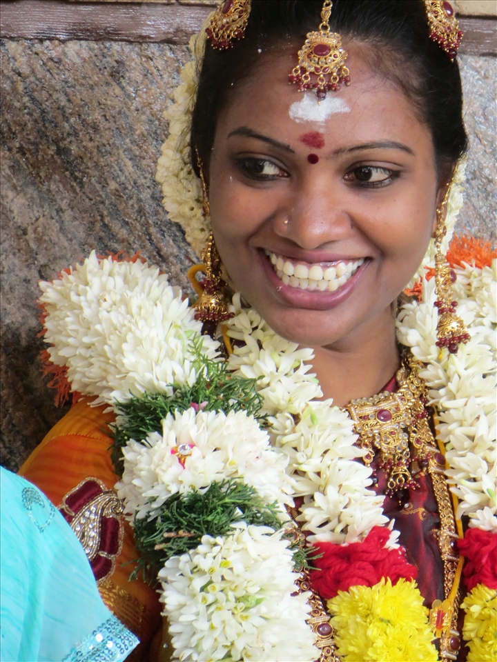 A smile full of hope and promise. A woman in love on her wedding day.