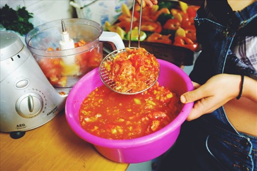 Strain the reserved tomato flesh and blend the solids in a food processor 