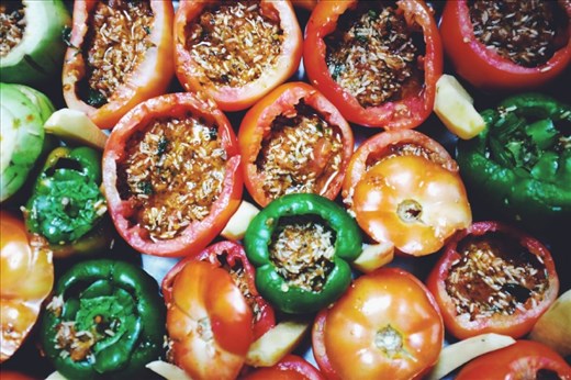 Wedge the potato in-between the tomatoes and peppers. 