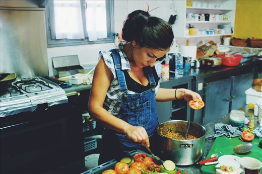 Epifania stuffing the tomatoes in the kitchen of her family's Taverna