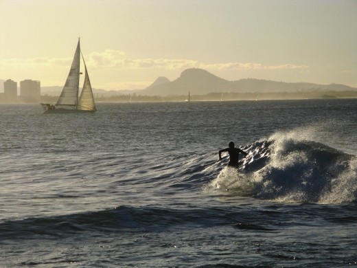 Wild and free. There is nothing quite so wild and free as being a part of the ocean. I think this picture captures the wild and free feeling of surfing and sailing. 