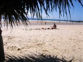 Chilled. A surfie gives up the waves and his friends for a while to chill on the beach with his guitar. The ultimate picture of a laid-back beach culture. : by jetha, Views[357]