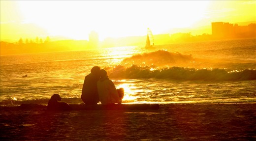 Loved. The sunset and the warm feeling in this photo make it a glowing, feel good shot. I imagine it as a happy ending to these people's story.