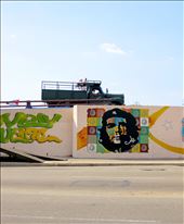 Revolutionary Spirit:
On every street corner and building there is evidence of the 1959 Socialist Revolution. This graffiti of Che Guevara (Revolutionary Leader) is one of the most iconic images of the revolution and is found all over the city, this particular image was taken in the old city on the median of a busy city street. It's both evidence of the collective past that Cubans have shared but also signifies the small piece of revolutionary each Cuban carries around with them. I think that the truck in the image represents Cubans carrying on with their lives amongst the memory of their incredible history. : by jetsettingadventurer, Views[493]