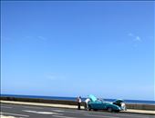 Repairs: Havana is filled with old buildings, cars and electronics. Most Cubans are very good at repairing things with very little given how old so much of what they use in their daily life is. This picture was taken on the Malecon as three men surrounded a broken down 50's car (an icon of Cuba in itself). : by jetsettingadventurer, Views[386]
