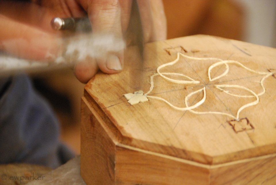 Behind the blue doors, are all kinds of artisans.