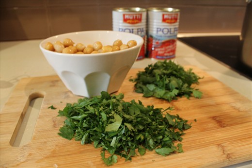 Adding the fresh chopped herbs and chickpeas