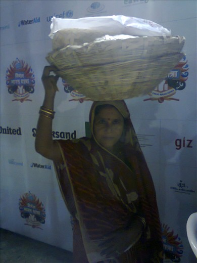 A lady at sanitation carnival after shopping stuff for famous Chath pooja.