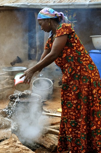 Woman cooking in a traditional village in Ghana. 