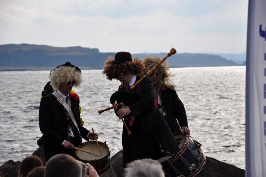 Easdale Island World Stone Skimming Competition - entertainment by some mad pipers
