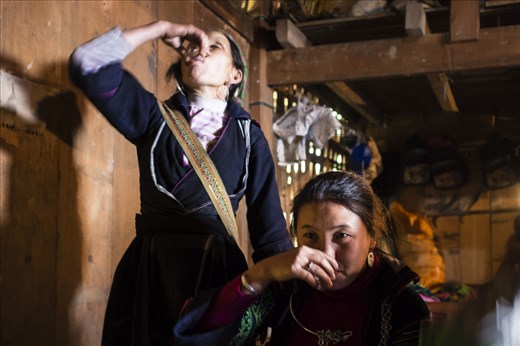 I was fortunate to spend three weeks in Sapa, Vietnam. Of the 52 ethnic groups that live in Vietnam, eight of them are located in Sapa and the surrounding area. On my second day there, I was invited to a traditional wedding reception for one of the young women that works as a tour guide - she was only 16 years old. 

It is customary for the father of the bride to thanks the guests for attending and drink a round of home made rice wine at each table. As the father had passed away, it was now the responsibility of the mother to greet the guests. There must have been at twenty table that she had to thank.