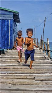 Two boys, running down a jetty in Semporna, Malaysia - just finished school.: by jlrobinson1, Views[482]