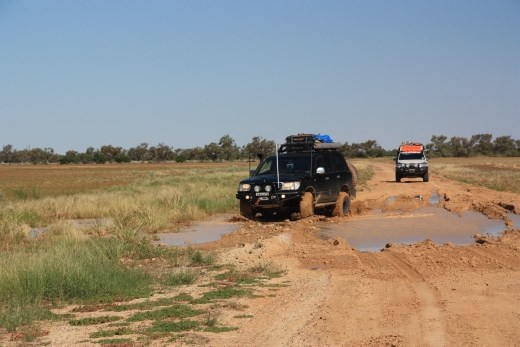 Schuey gives his 35 inch muddies a workout in one of the mud holes remaining after the recent rain
