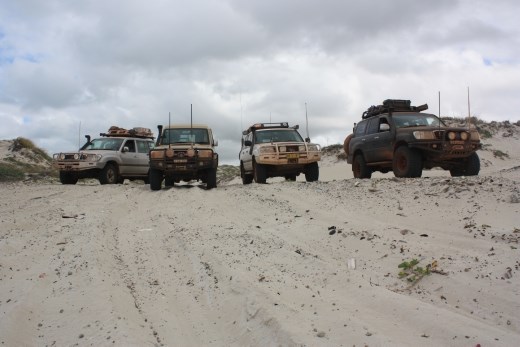 Vehicles lined up about to head off for the long beach drive up to Cape Arnhem