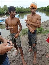 Their bodies well conditioned from a hard and dangerous living local fishermen joke and discuss the days catch as they pass out kretek clove cigarettes in the Belu Regency of Western Timor : by jmitchell, Views[842]