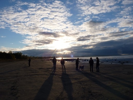 'For where two or three are gathered in my name, there am I among them. - Matthew 18:20'
A family takes an evening stroll along the beach.