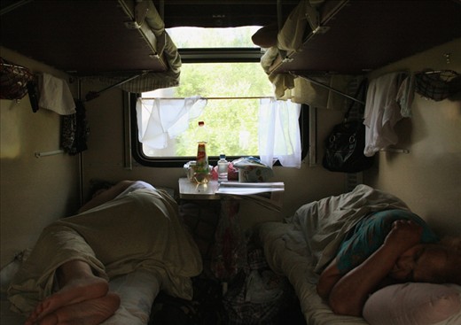 Fellow passengers asleep aboard the train in the middle of the day. Apart from playing cards, making conversation and looking out of the window, this was the only other option.