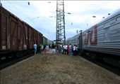 Passengers stretching their legs and chatting in the Summer heat of Russia after the train has made one of the few stops during the day.: by jmshannon, Views[228]