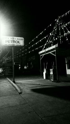 This Image, is of an original service station located in Melbournes outer suburbs. I have taken this image at night in order to translate my interest in light and the essence of places during the night. This Image represents my interest in place and car travelling.
